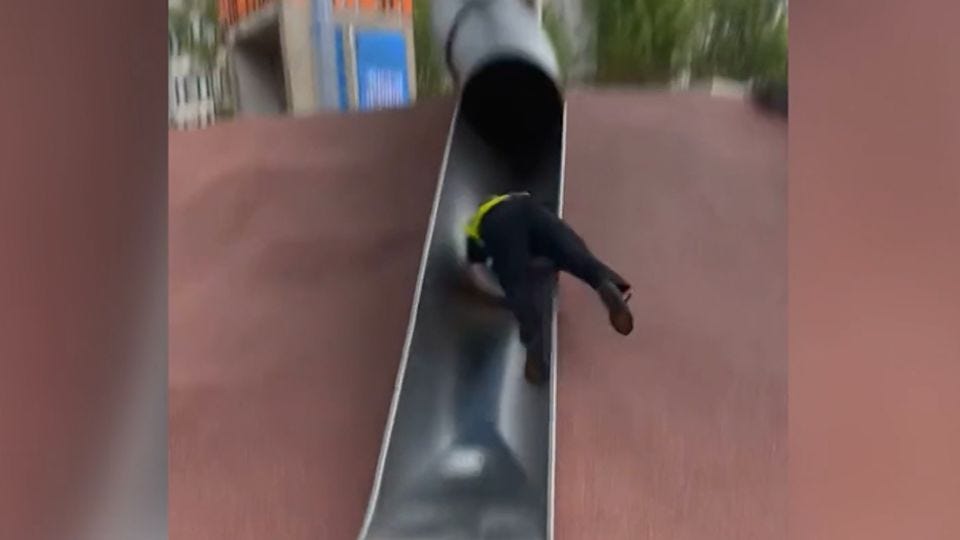 Watch: Video shows Boston police officer catapult off playground slide