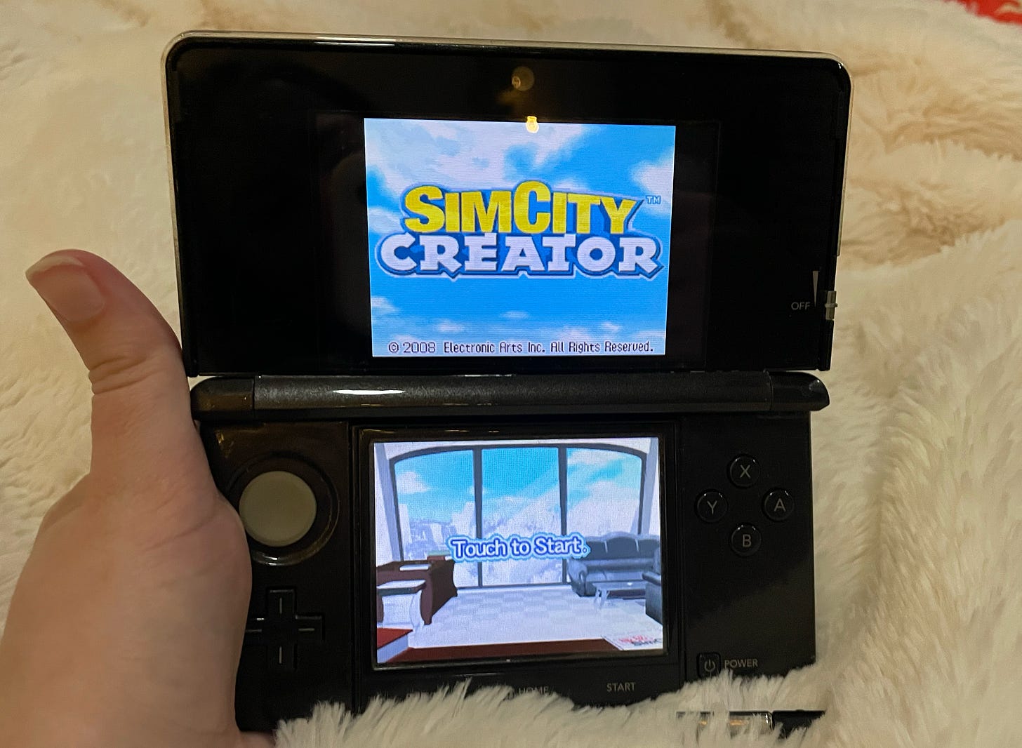 SimCity Creator landing page on a black Nintendo DS