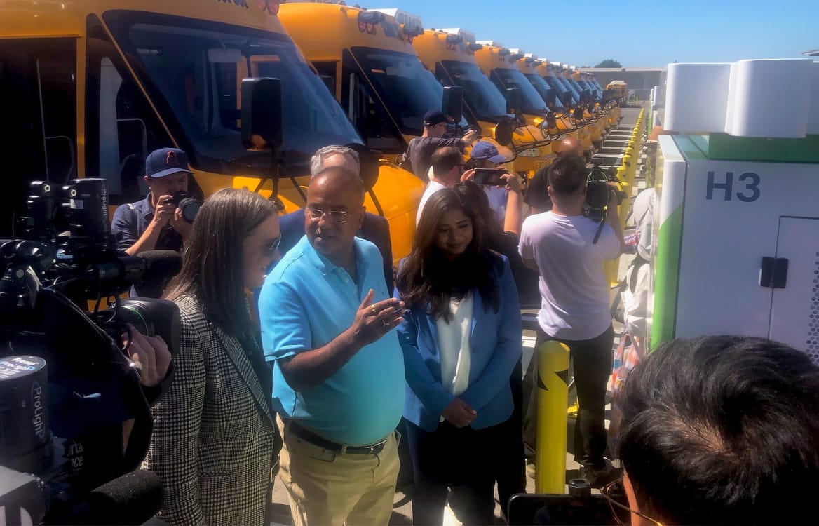 PG&E CEO Patti Poppe, Zum EV Program Manager Pallav Prakash, and Zum CEO Ritu Narayan at electric school bus depot in Oakland