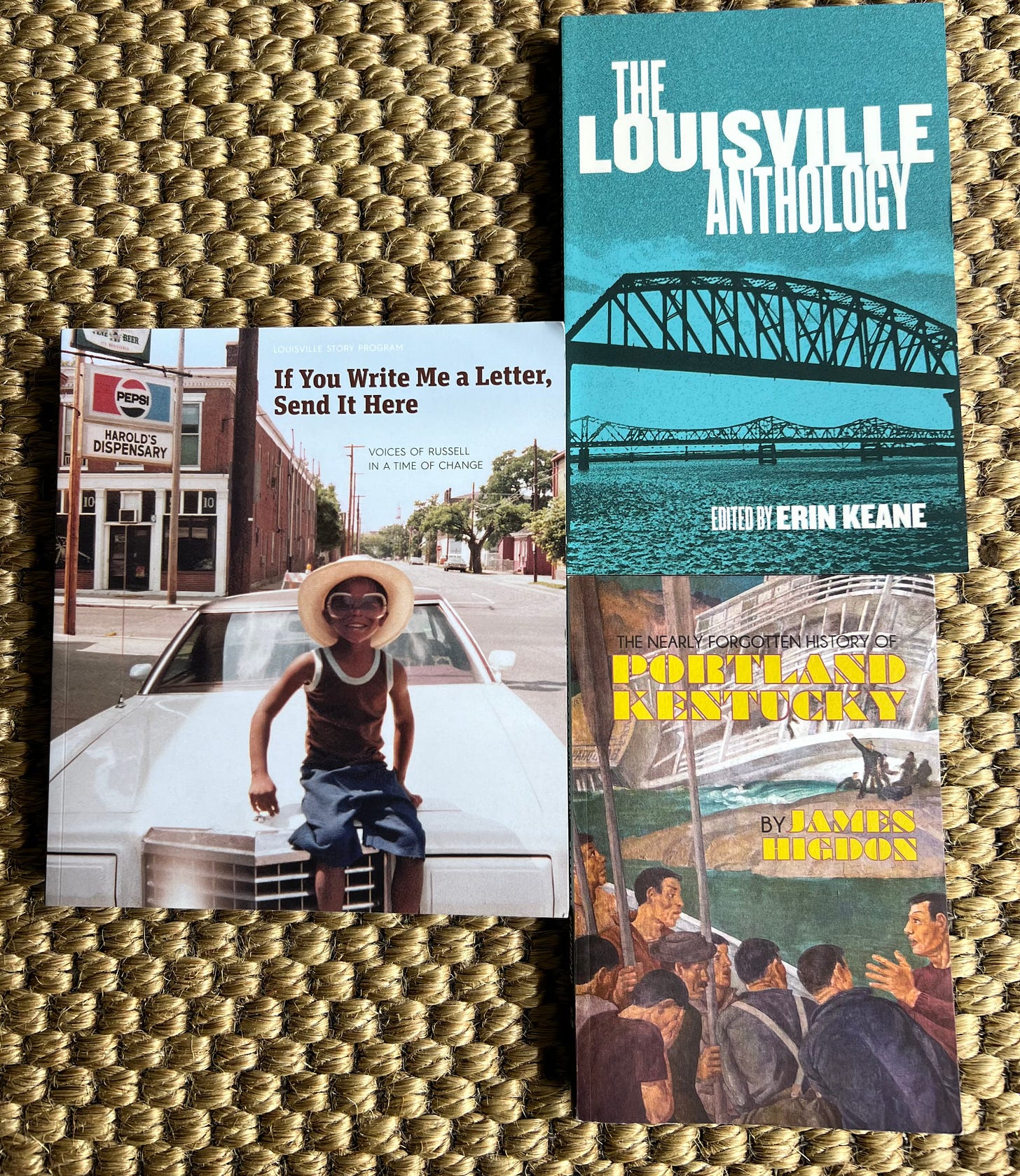 Books (L-R) "If you Write me a Letter, Send it Here," "The Louisville Anthology," "The Nearly Forgotten History of Portland Kentucky"