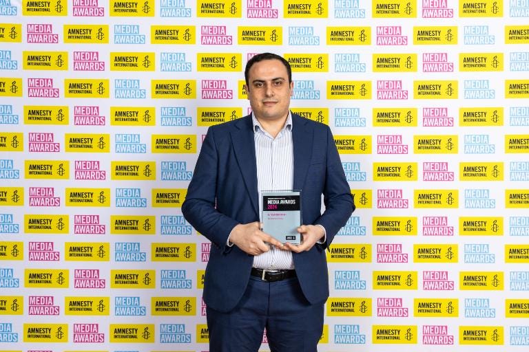 Ahmed Alnaouq with Outstanding Impact Award from Amnesty International.