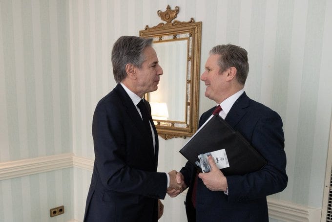 Secretary Blinken shakes hands with UK Labour Party leader Keir Starmer in Munich, Germany.