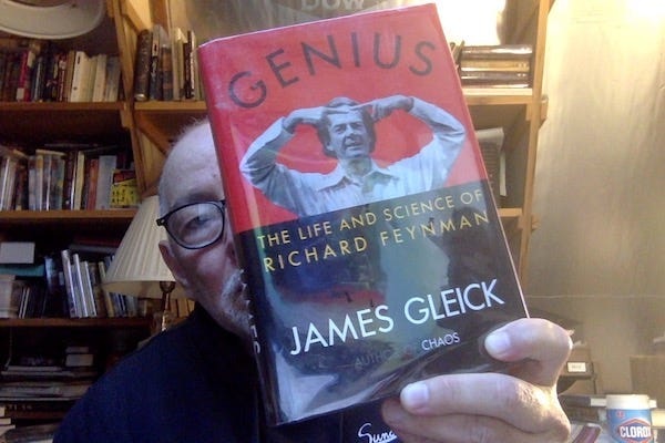 Photo of me hold a copy of Gleick's book "Genius"