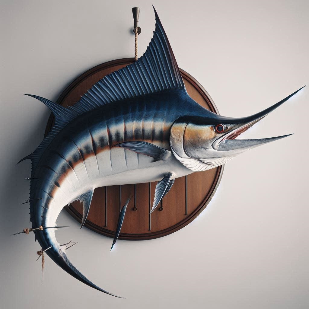 A marlin fish with a big fin and snout and dramatic white below-metallic blue above coloring, mounted on a plaque on a wall