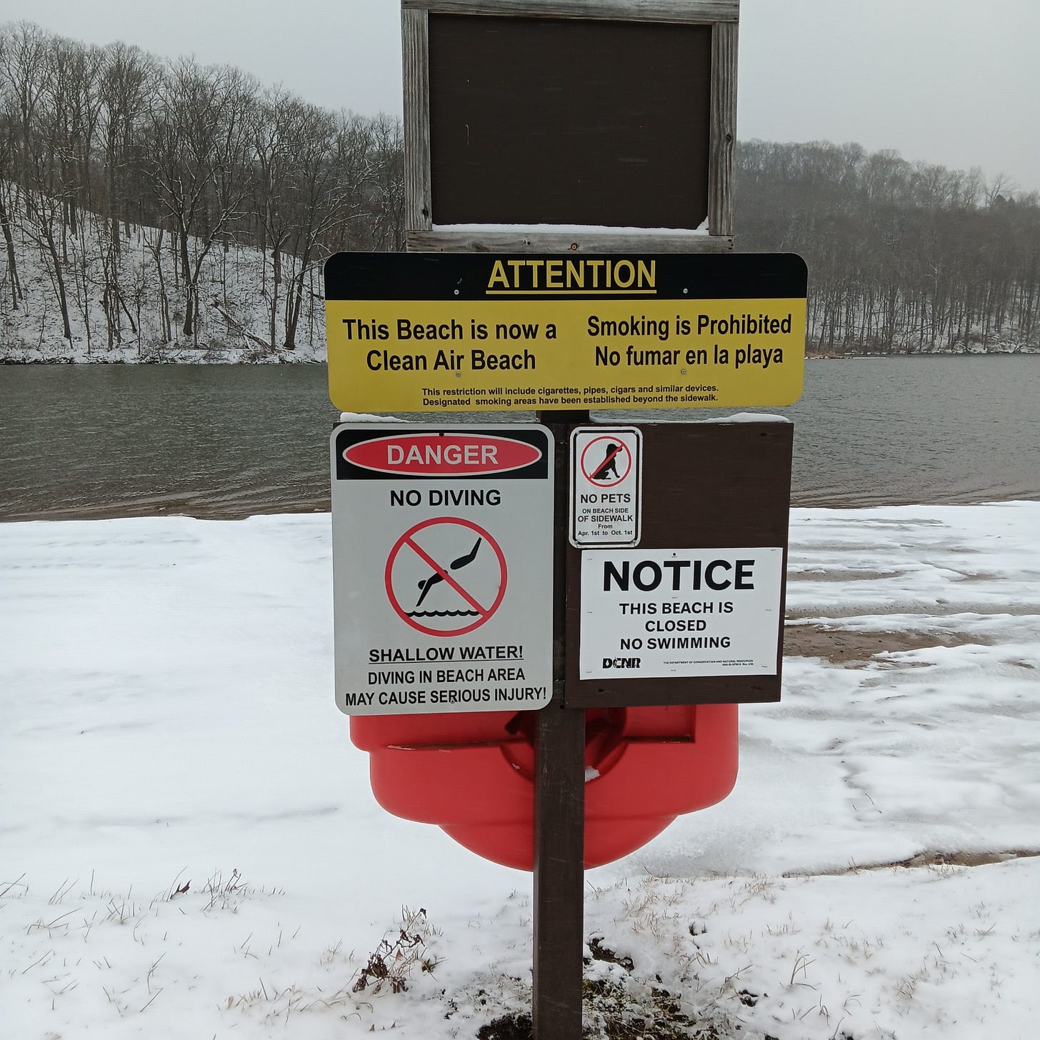 The beach at Raccoon Creek, with an unnecessary sign saying "no swimming" because it's snowing out. Taken by Mary Pezzulo.