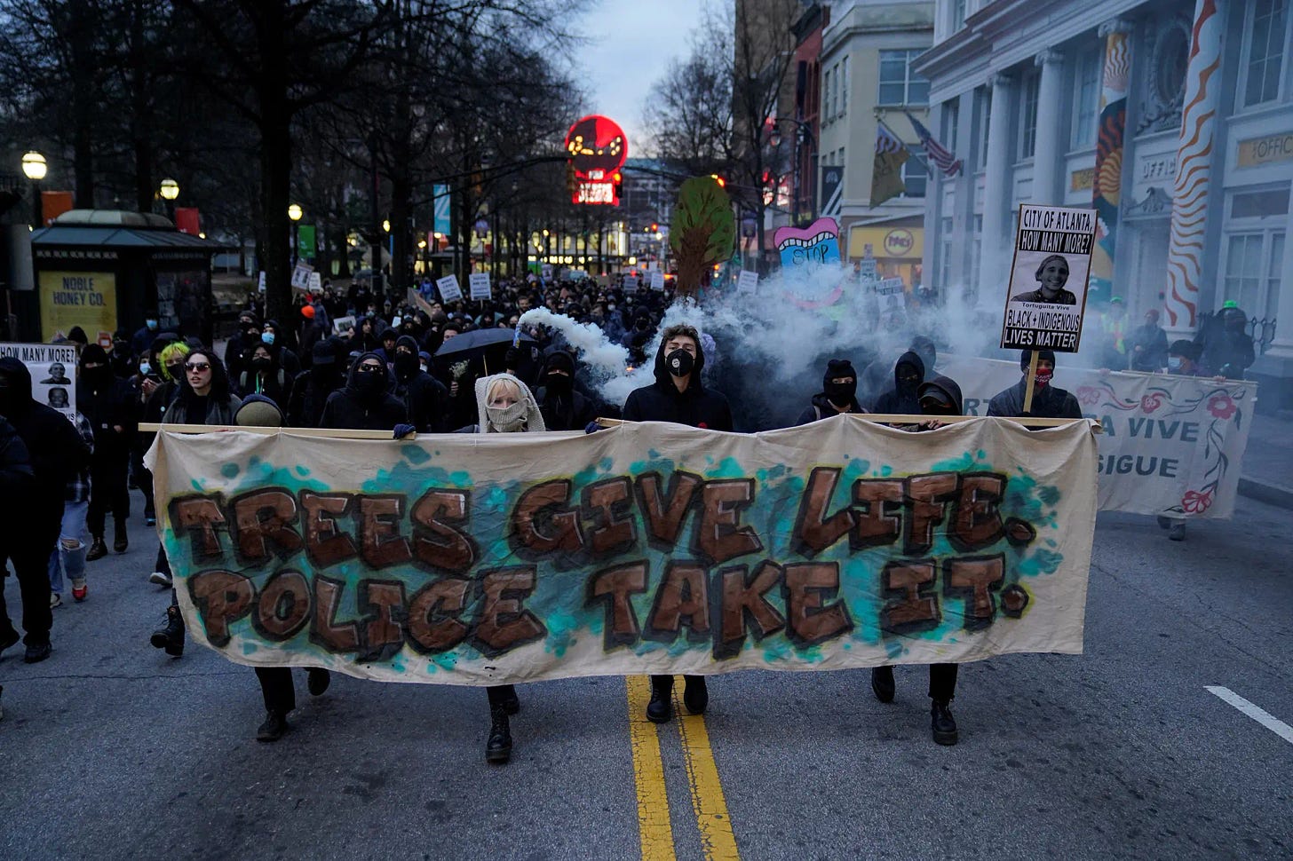 Protestors march in Atlanta on Saturday, Jan. 21, 2023, during demonstrations related to the death of Manuel Teran.