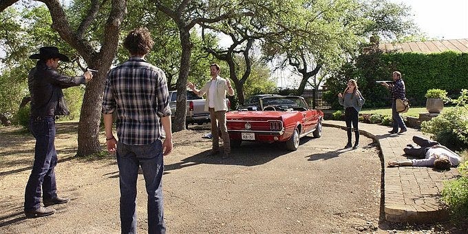 Walker Clint holding gun on Cordell and STella.