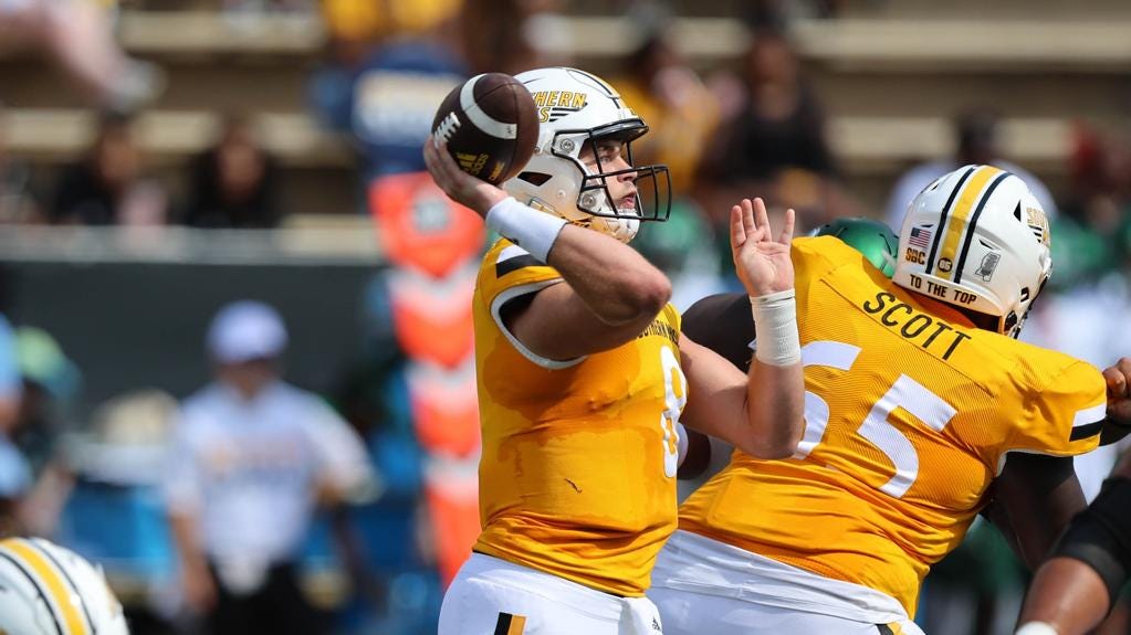 Football vs Tulane - Image 6: Southern Miss Golden Eagles quarterback Billy  Wiles (8) throws a pass in a game between the Southern Miss Golden Eagles  and Tulane Green Wave in the