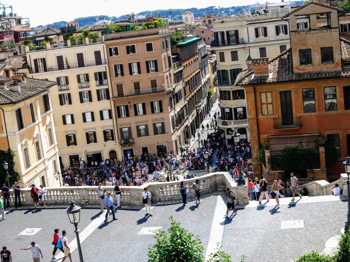 Looking down at the plaza in front of the Spanish Steps. The area is absolutely packed with people.