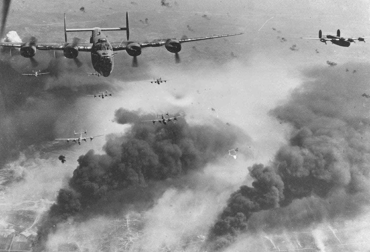 B-24s fly over Ploesti, Romania.  The air is thick with smoke and explosions.