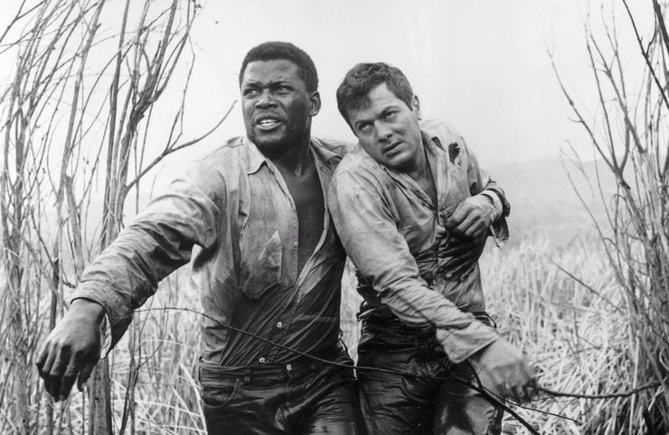 Sidney Poitier and Tony Curtis in The Defiant Ones [Stanley Kramer, 1958].  Thanks to @TheCozens. 
