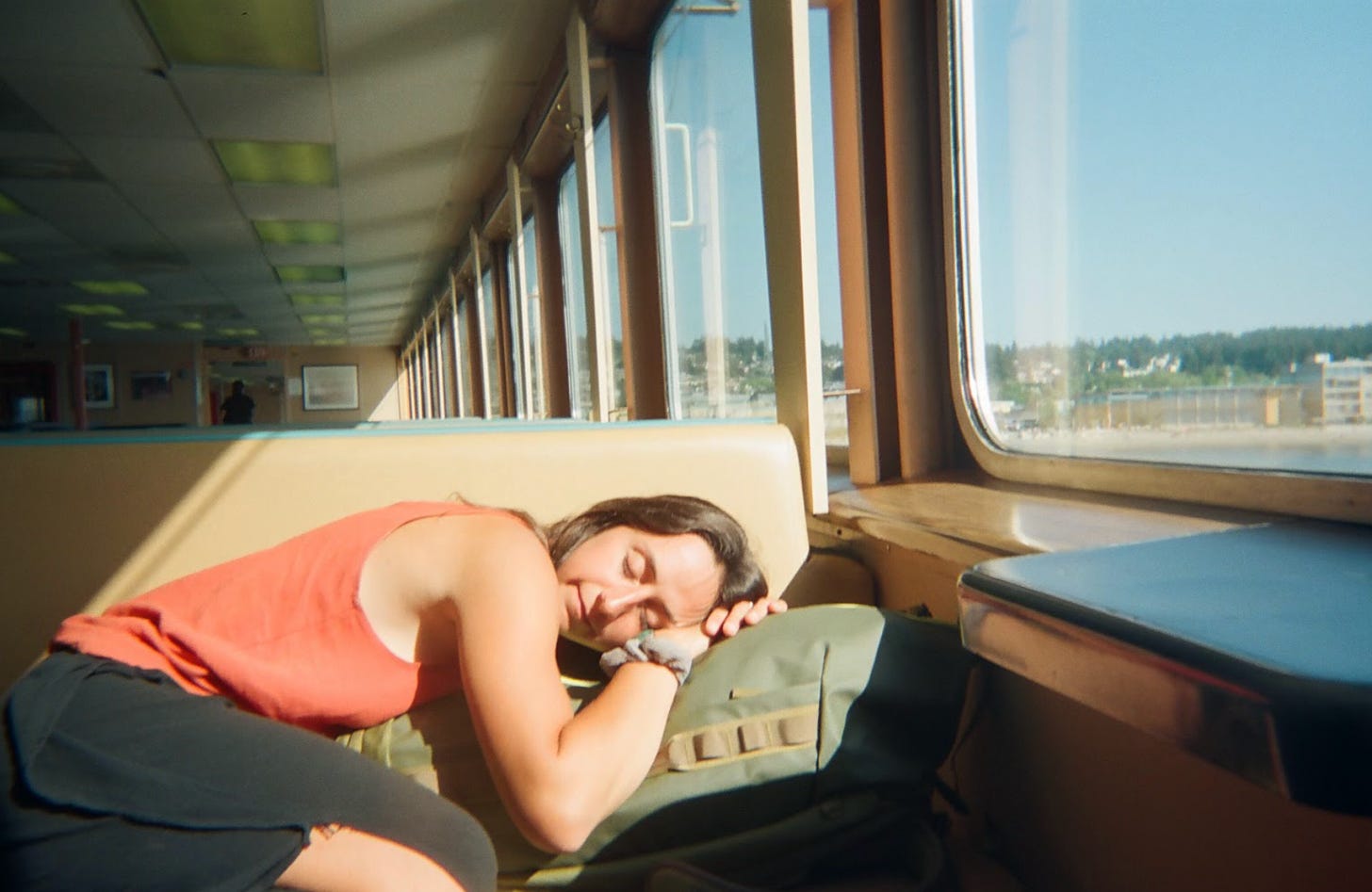 Author sleeps in sun patch on ferry