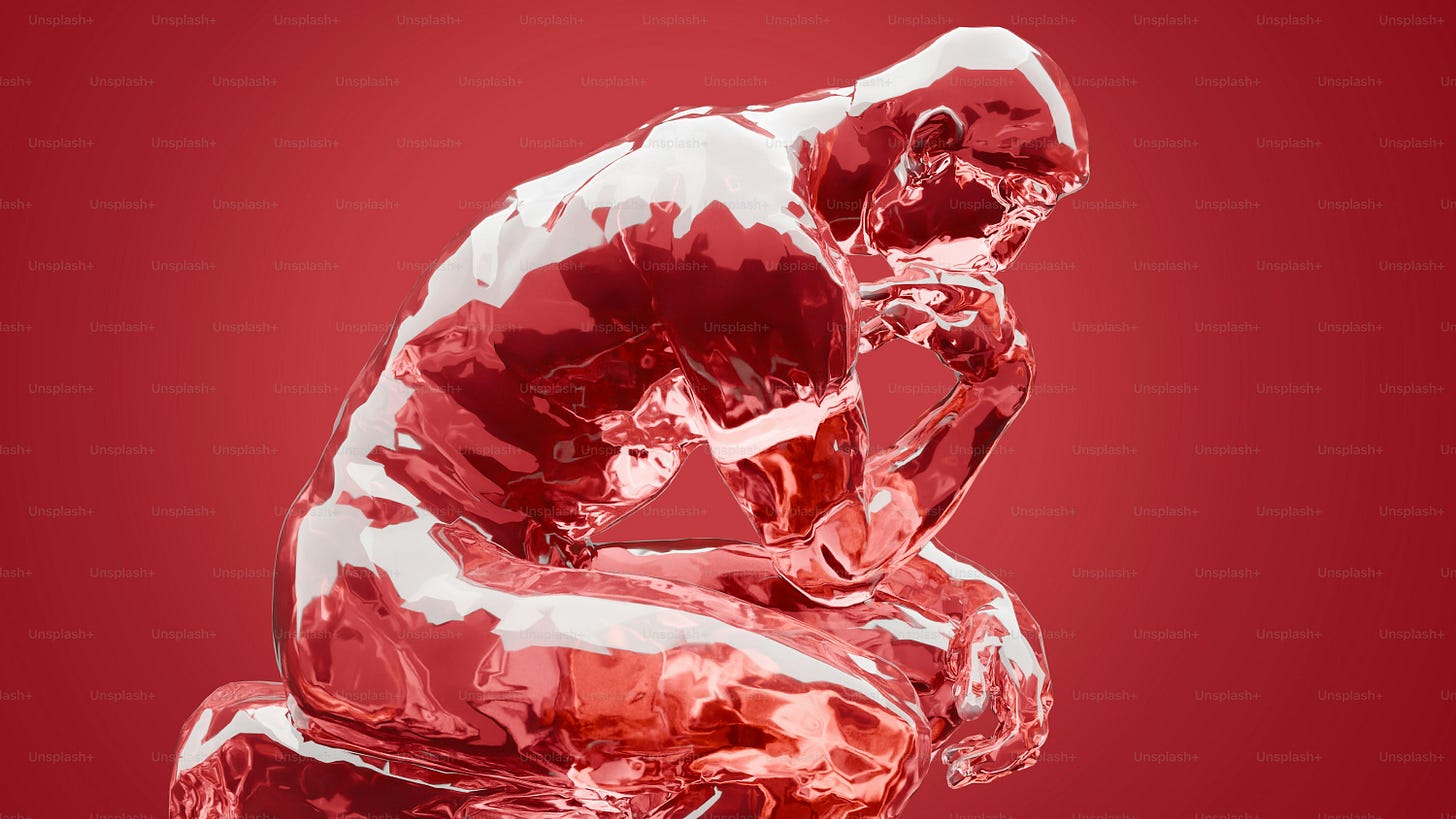 A glass sculpture of a person sitting on a stool A glass sculpture of a person sitting on a stool