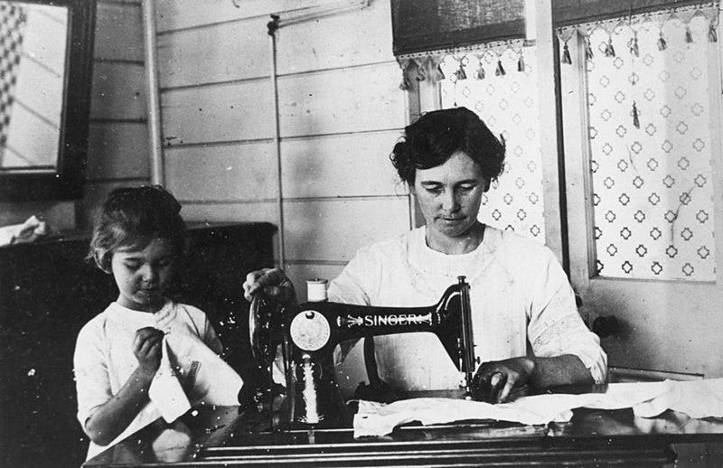 File:Violet Trundle sewing with a Singer sewing machine at her home in Hughenden, ca. 1925 (4582708639).jpg