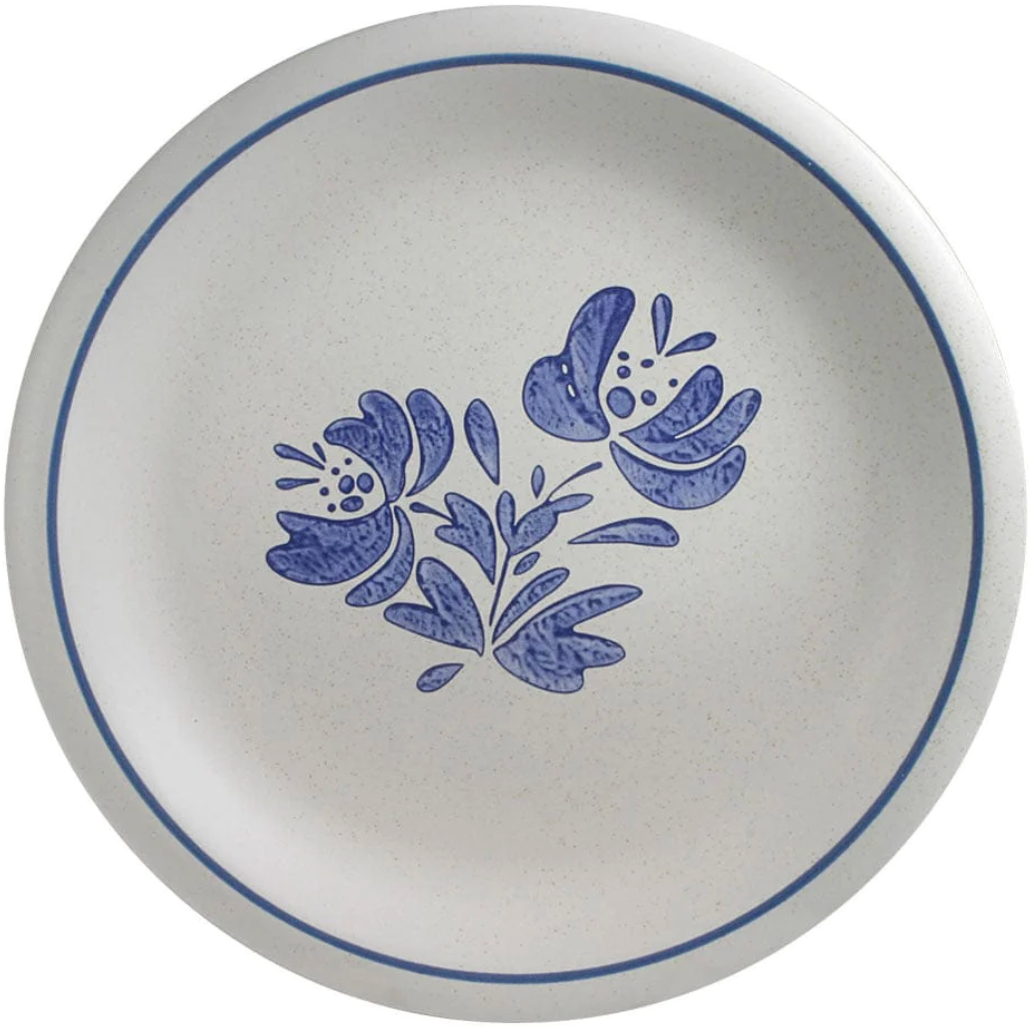 A photo of a classic Pfaltzgraff “Yorktown” dish pattern featuring blue floral designs on a white stone background.