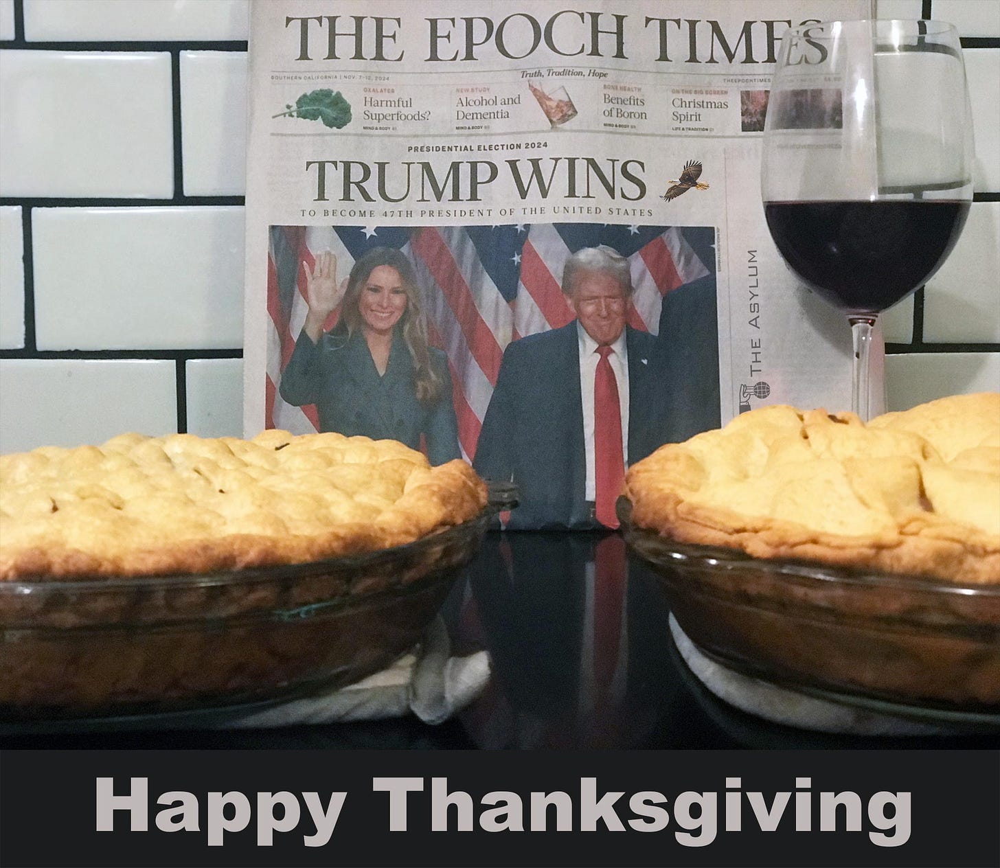 Two pies, paper that says Trump Wins and a glass of wine. Happy thanksgiving.