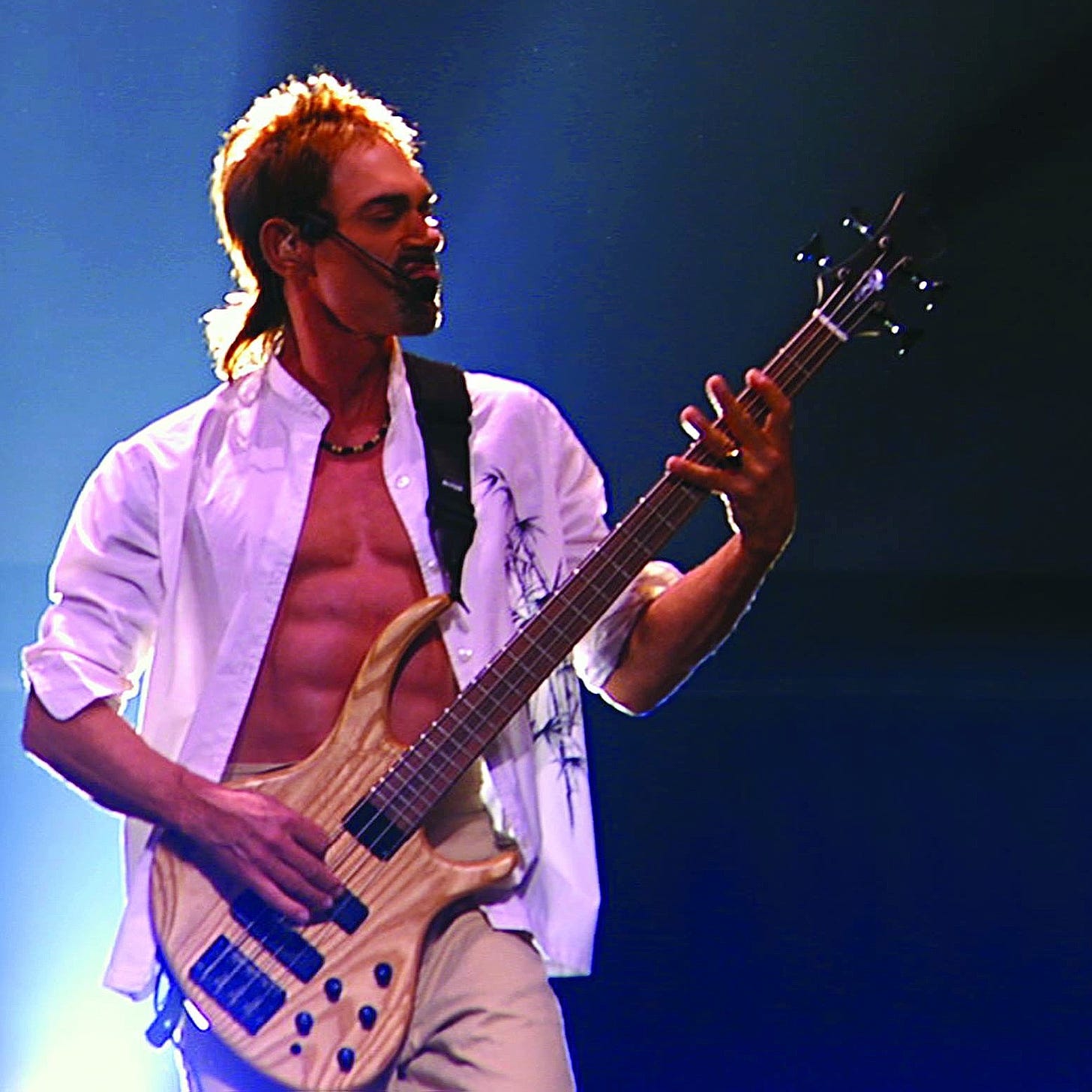 Andy Fraser playing bass guitar 