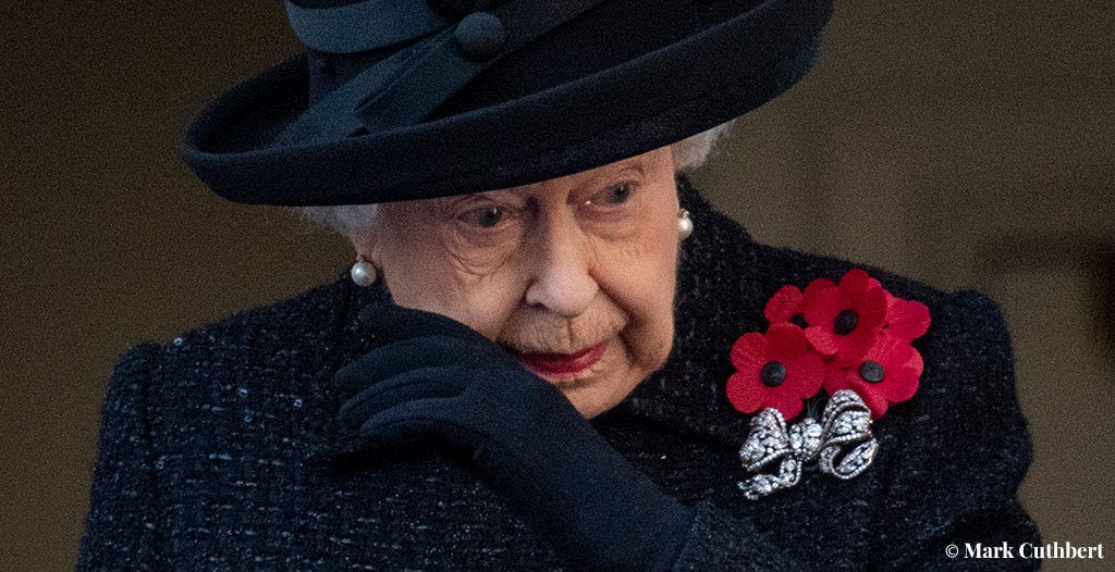 Queen Elizabeth II wipes away a tear as she watches the Remembrance Sunday ceremony from a balcony overlooking the Cenotaph on November 10, 2019