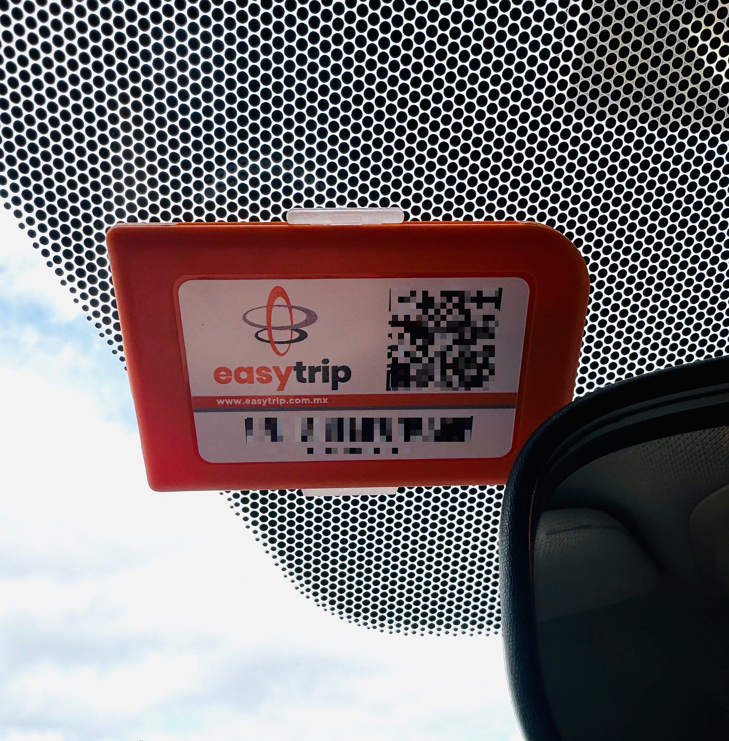 Close up of an EasyTrip electronic toll pass