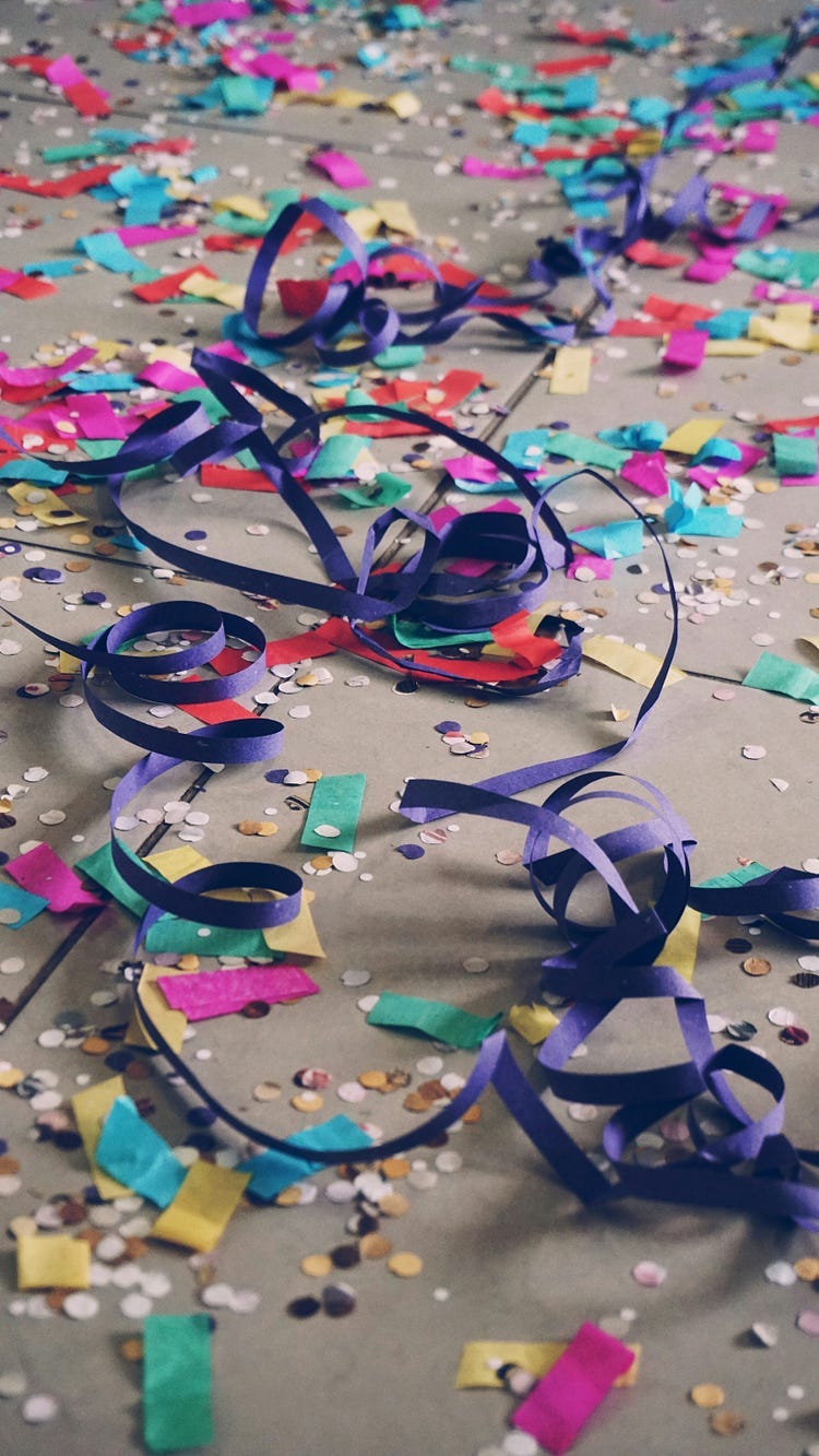 ribbons and tinsels of a celebration on the floor.