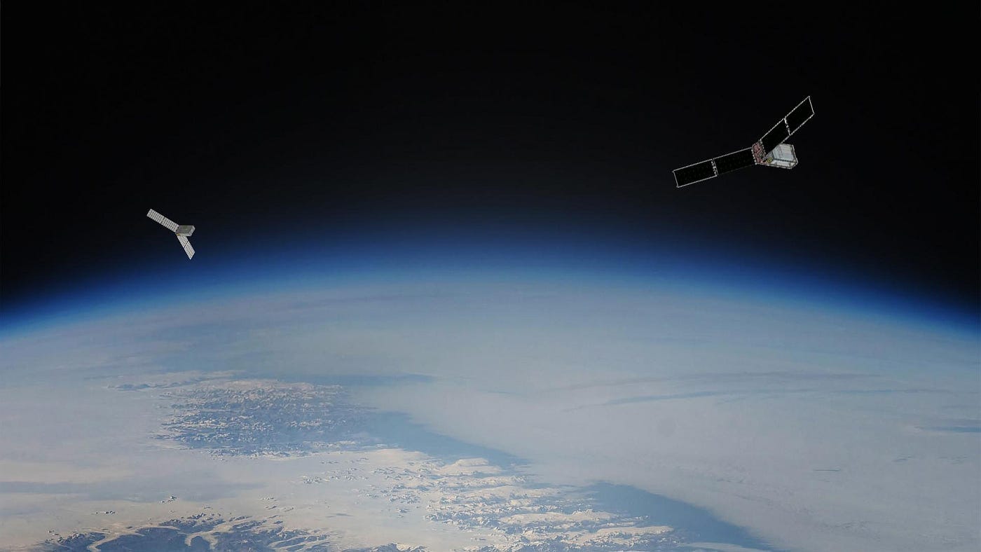 Two CubeSats, shown as an artist’s concept against an image of Earth from orbit.