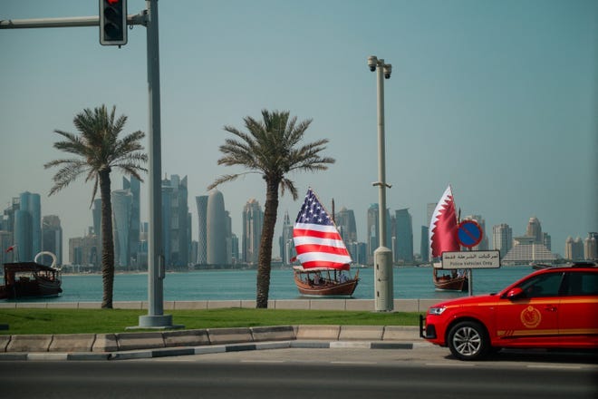 Boats, carrying the U.S and Qatari flags as their sails, move on the day President Donald Trump visits Doha, Qatar, May 14, 2025.