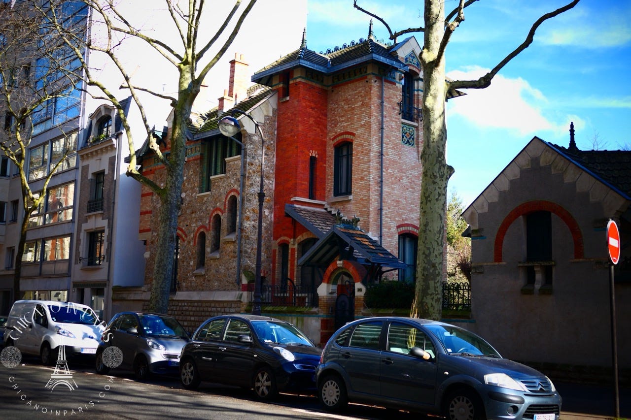Beautiful brick building along a Parisian street.