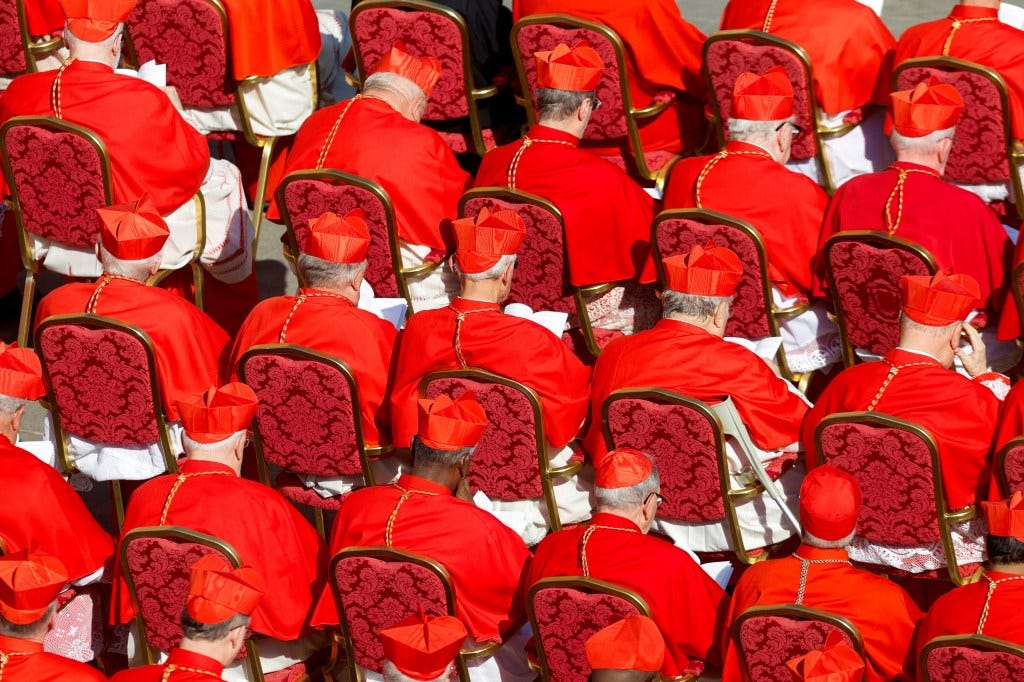 The cardinals sitting chairs during ceremony in St. Peter's Square Saturday. 