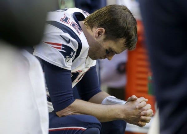 tom brady sitting on bench super bowl xlix new england patriots 2015 images