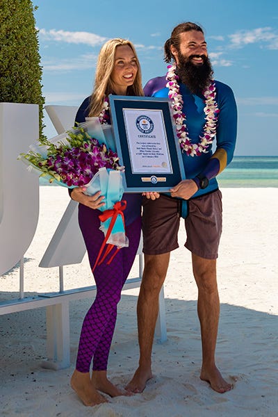 beth and miles with their certificate