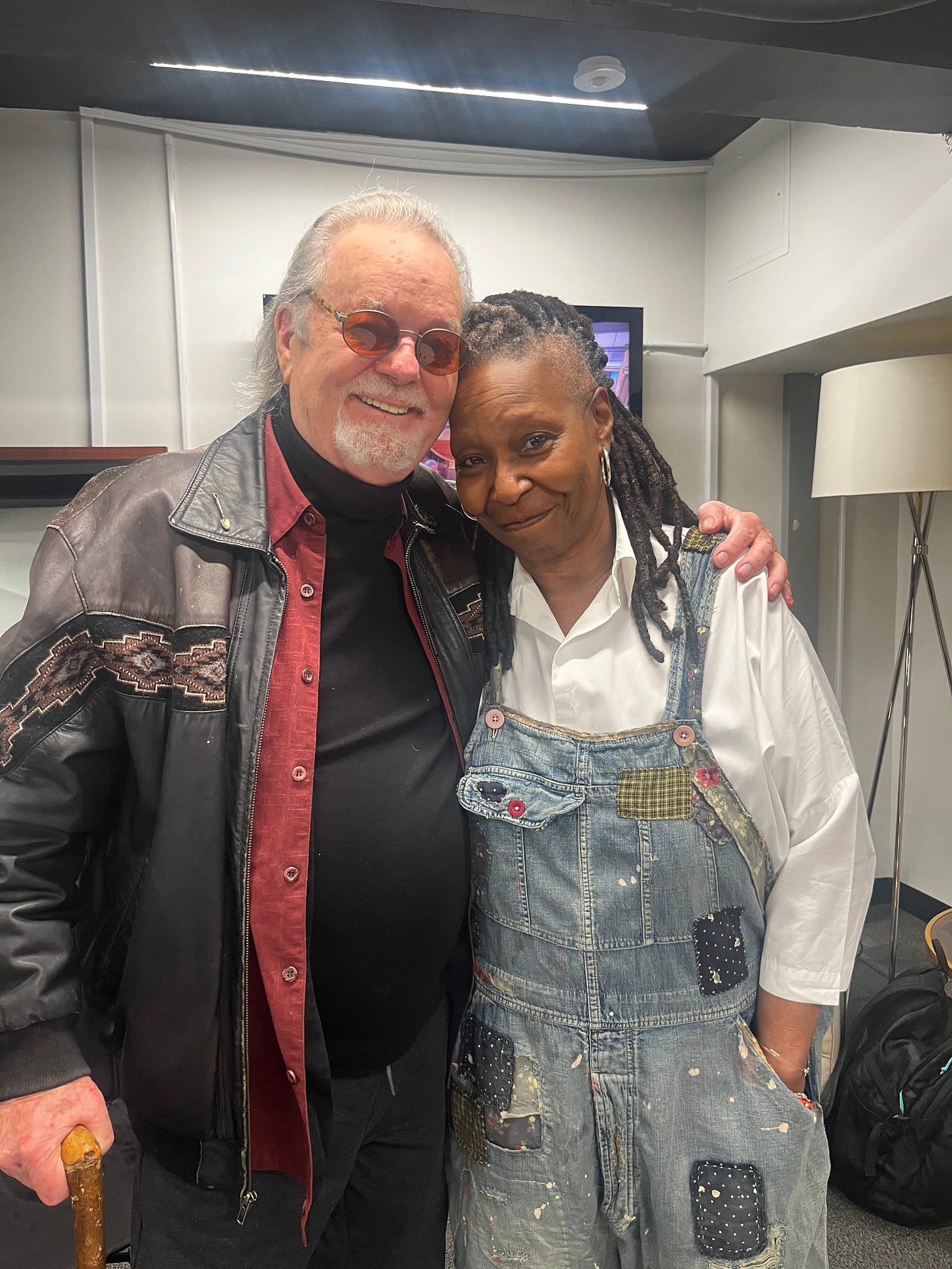 Russ Tamblyn and Whoopi Goldberg pose together in "The View" greenroom. 