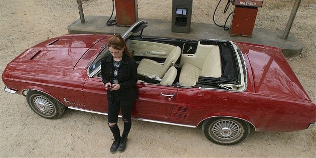 Walker Stella outside red convertible waiting for Trevor 1.11.