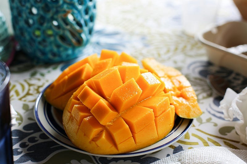 Cubed mangoes in a dish Cubed mangoes in a dish