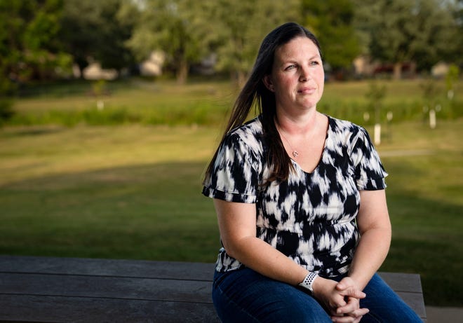 Jane Day sits for a photo in a park near her home in Norwalk, Thursday, Aug. 24, 2023.