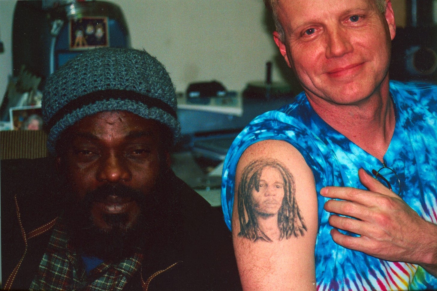 r to mine, and we had to snap a photo.    Me showing off my Bob Marley tattoo to Aston “Family Man” Barrett of the Wailers, 2007