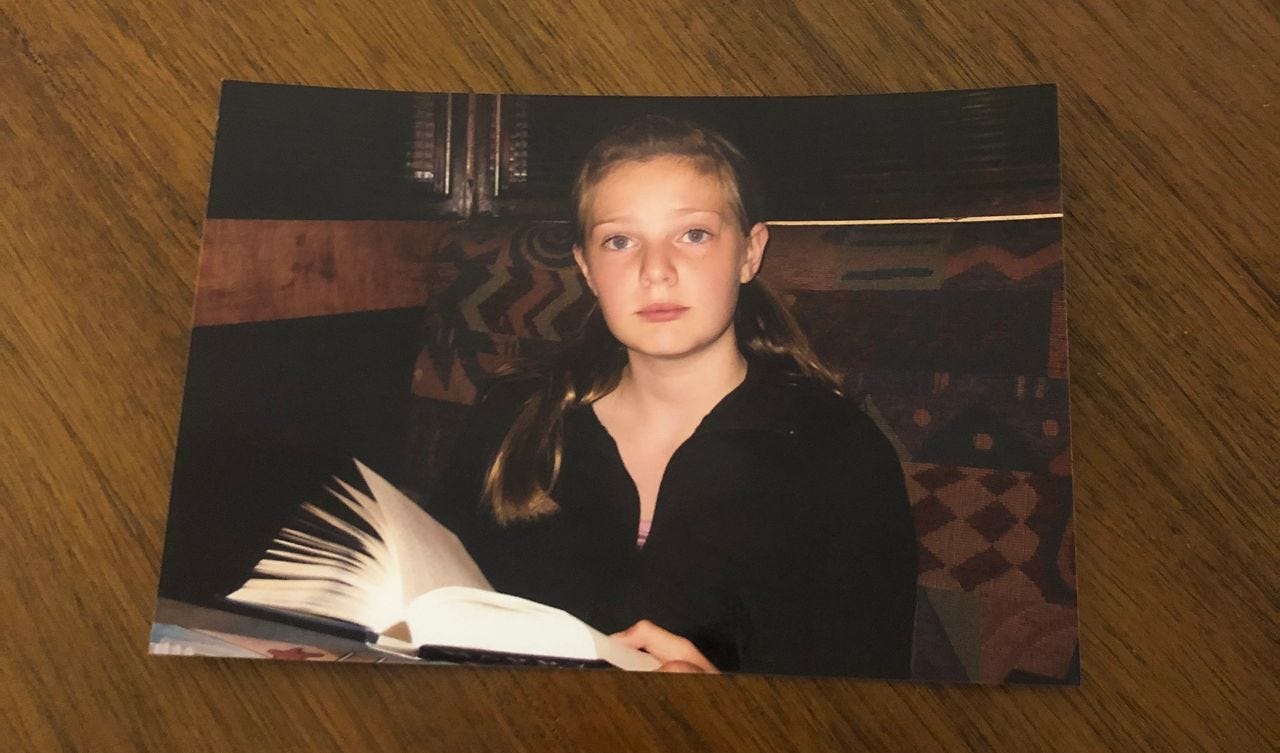 Me reading Harry Potter and the Deathly Hallows for the first time. I was so engrossed I even read the book when we went out to dinner one night, where this picture was taken 