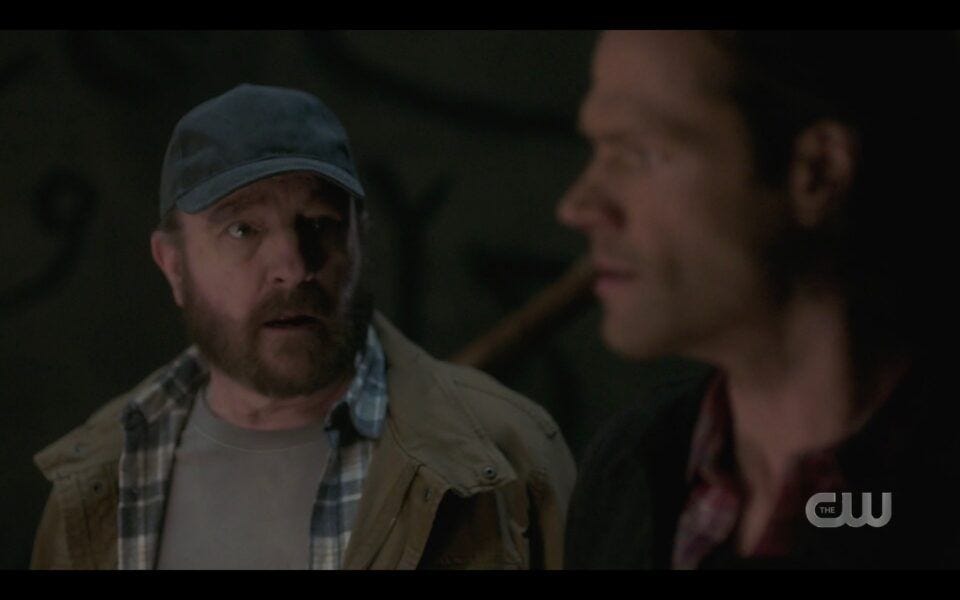 Sam Winchester standing next to Bobby in silo SPN 1518