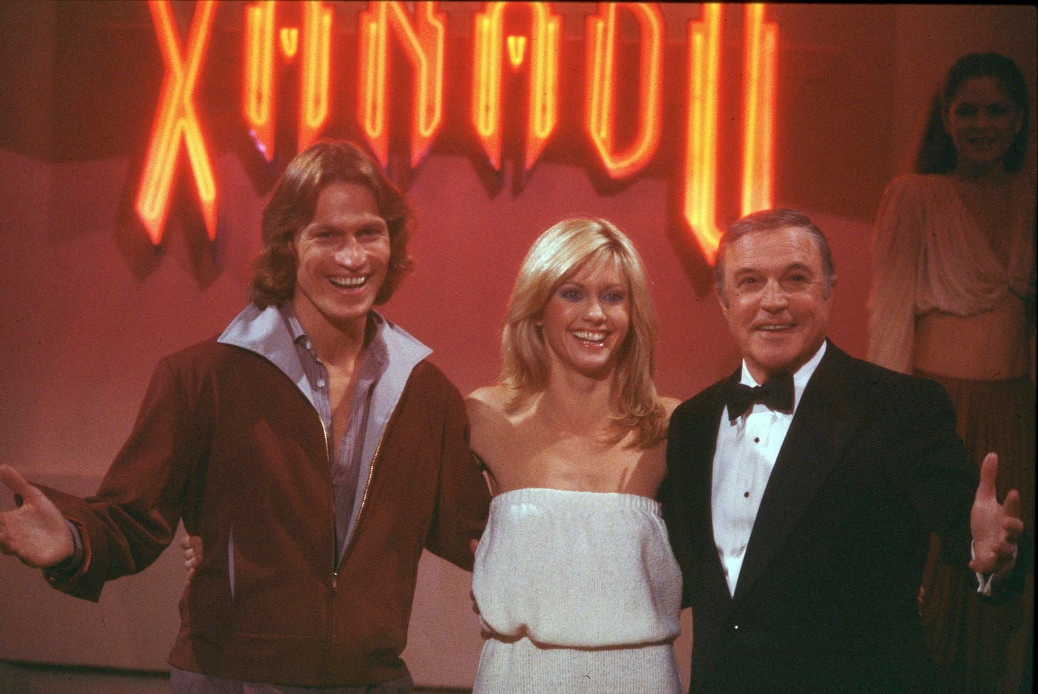 Still from the 1980 movie musical Xanadu featuring Michael beck, Olivia Newtown-John and Gene Kelly