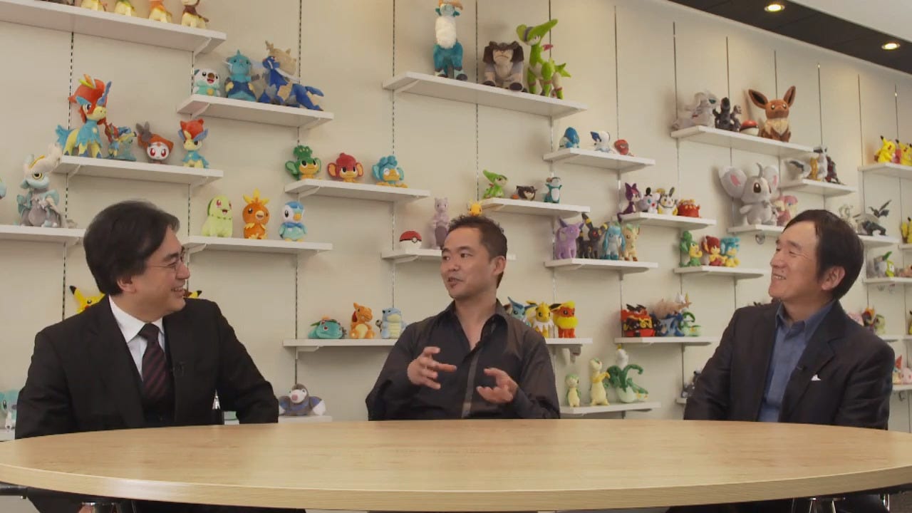 Iwata during an interview with Junichi Masuda (Director, now Chief Creative Fellow), and Tsunekazu Ishihara (President and CEO) in 2013