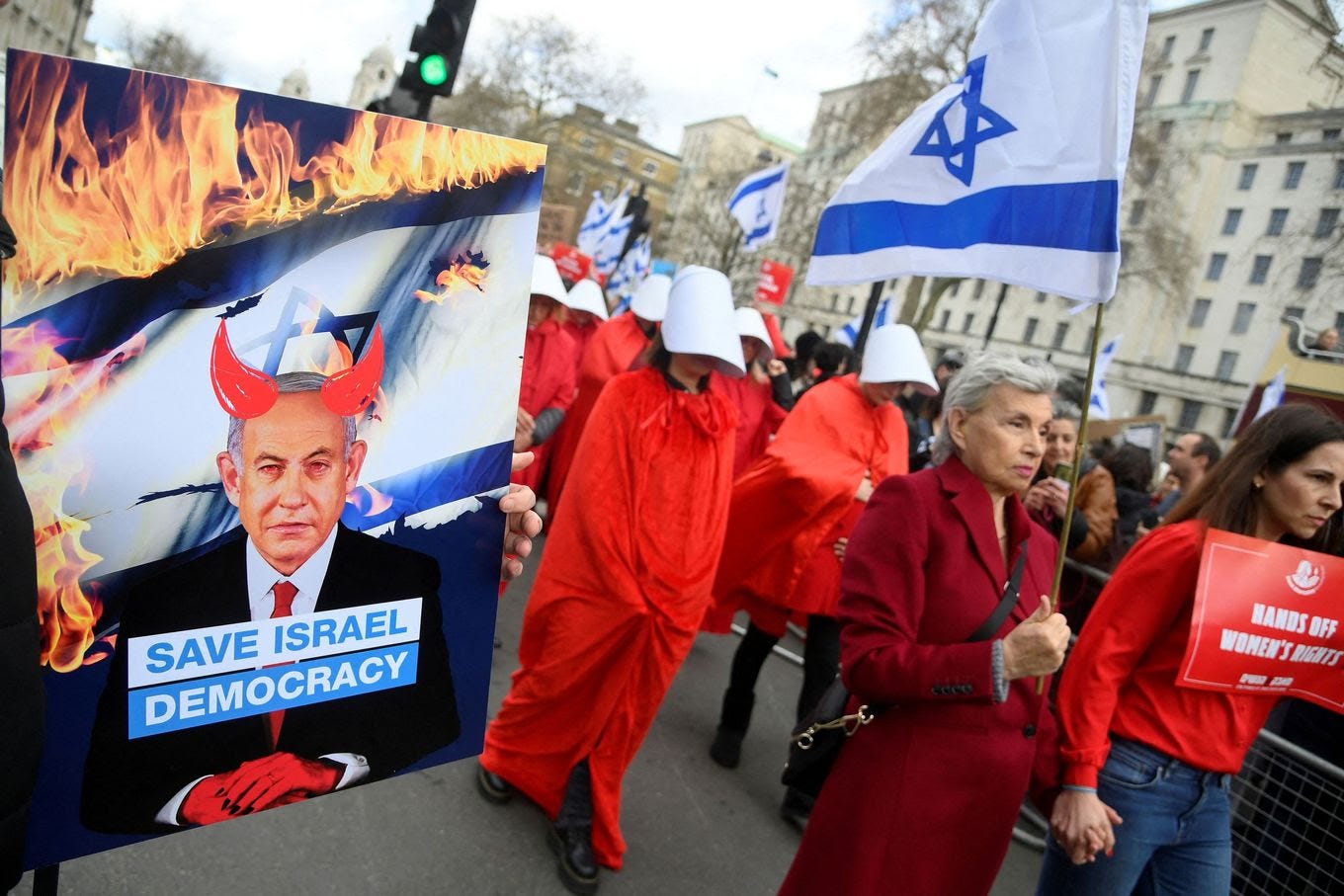 Women's rights activists protest Israeli Prime Minister Benjamin Netanyahu as he visits London on Friday. (Toby Melville/Reuters)