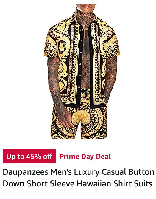 Ad for clothing; a tattooed man is wearing pants and a button up that are black with gold designs. The crotch of the pants is basically solid gold with some lil loops in it and stands out like a sore thumb