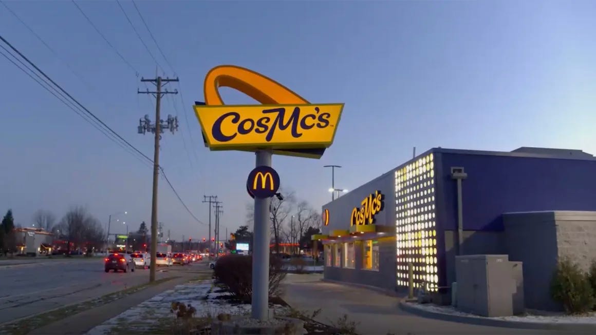 Outside of the CosMc's restaurant; building is blue and the logo on the sign out front is just half of a McDonald's arch on its side above the word "CosMc's".