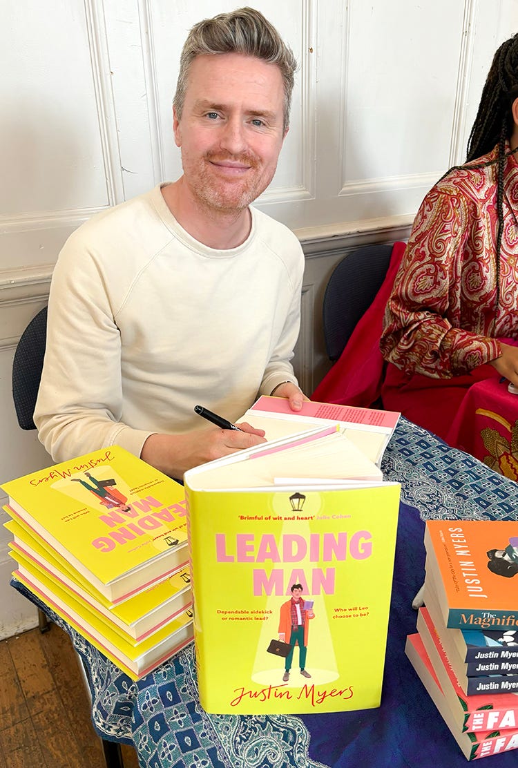 Justin Myers Lighthouse Bookshop Festival 2024 siging copies of Leading Man