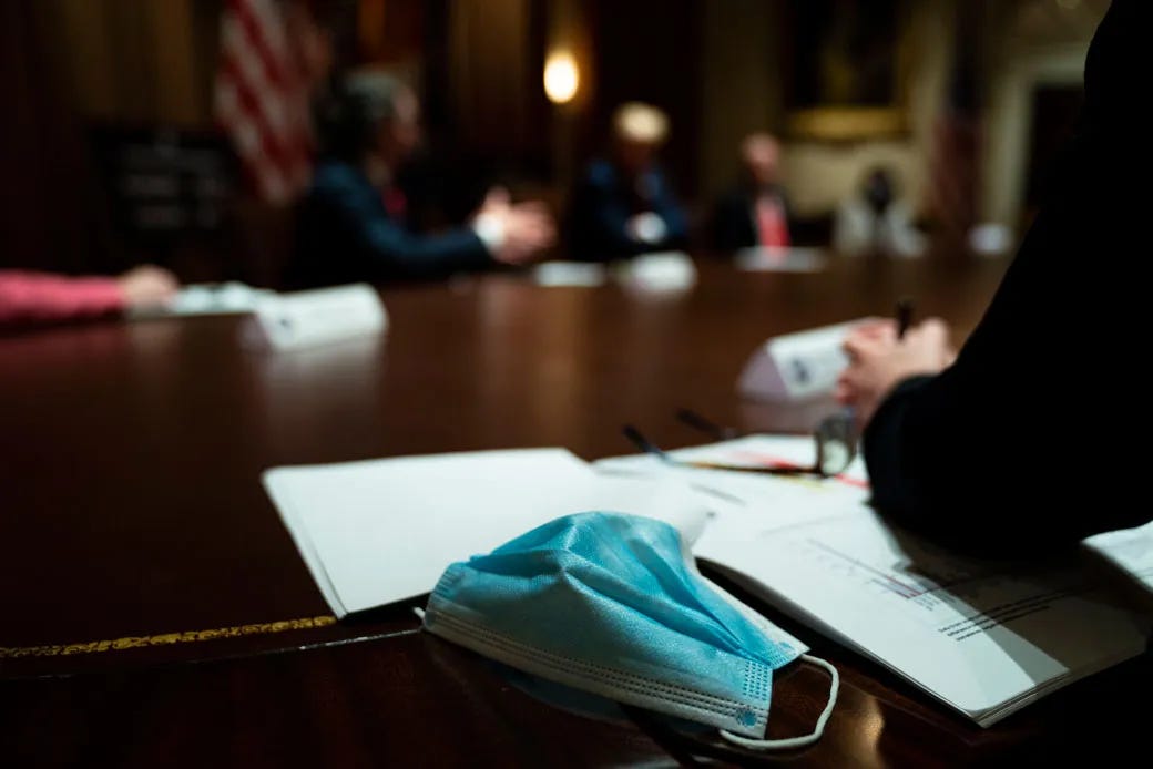 A mask sits on the table as U.S. President Donald Trump meets with governors in the Cabinet Room of the White House on May 13, 2020, in Washington, D.C. (Getty/Doug Mills-Pool)