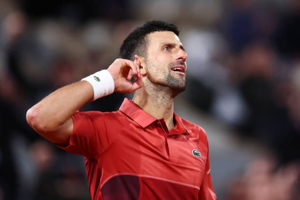 Novak Djokovic of Serbia celebrates a point against Lorenzo Musetti of Italy in the Men's Singles third round match at Roland Garros on June 01, 2024...