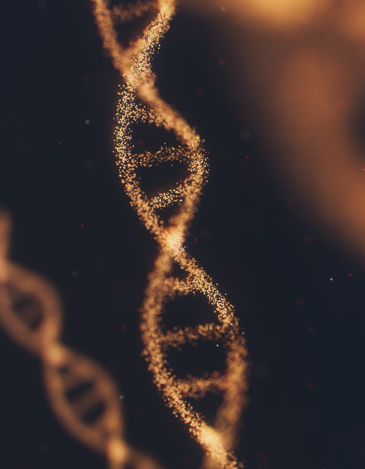 A computer-rendered image of a strand of DNA, made up of glowing yellow specks, against a dark background