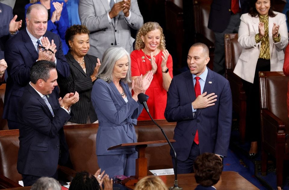 House Democratic Leader Hakeem Jeffries is flanked by Rep. Katherine Clark and House Democratic Caucus Chair Pete Aguilar after he was nominated to be the next Speaker of the House on Friday. Jonathan Ernst/Reuters