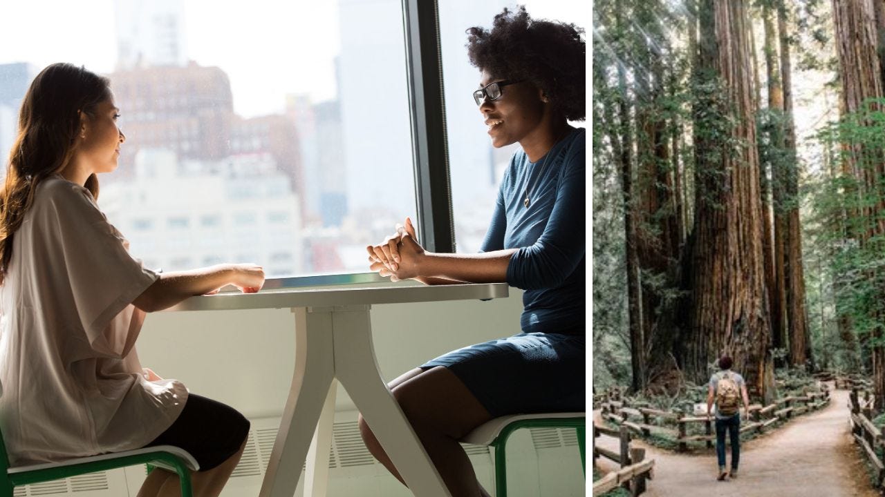 two women talking, person in forest