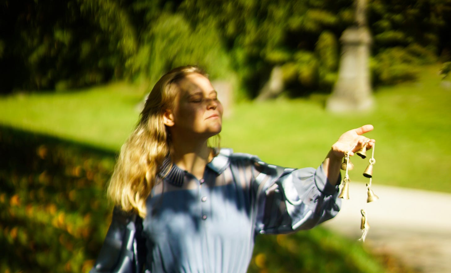 Concetta holding bells and listening to the sounds of nature at Greenwood Cemetery Concetta holding bells and listening to the sounds of nature at Greenwood Cemetery