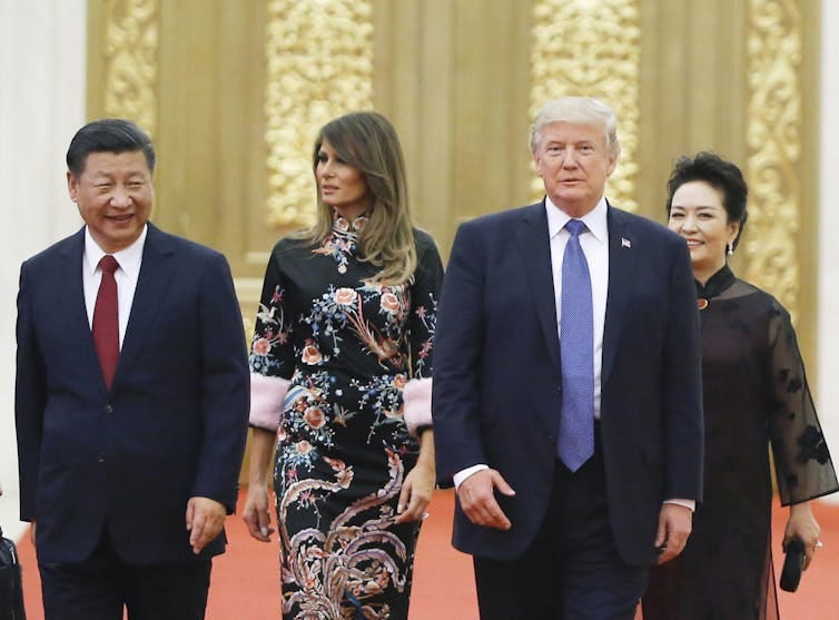 Xi Jingping and his wife Peng Liyuan with Donald and Melania Trump. Xi Jingping and his wife Peng Liyuan with Donald and Melania Trump.